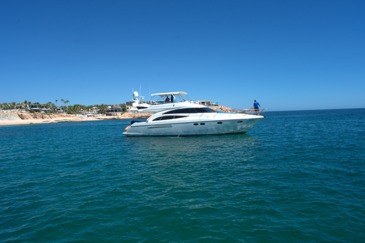 Luxury 80ft Azimut superyacht cruising the Sea of Cortez at sunset Cabo San Lucas